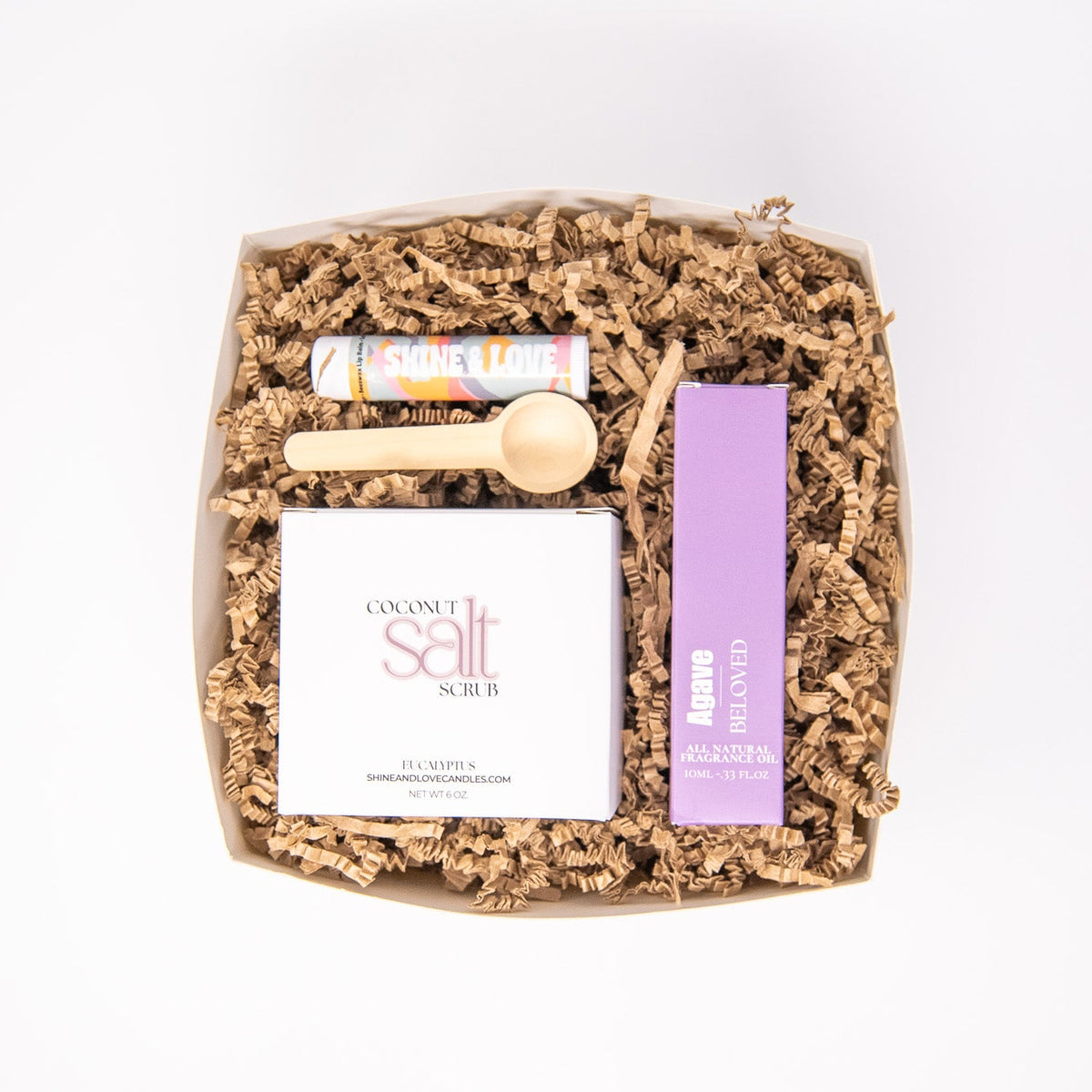 Gift set with bath products including salt scrub, roll on perfume oil, and beeswax lip balm chapstick