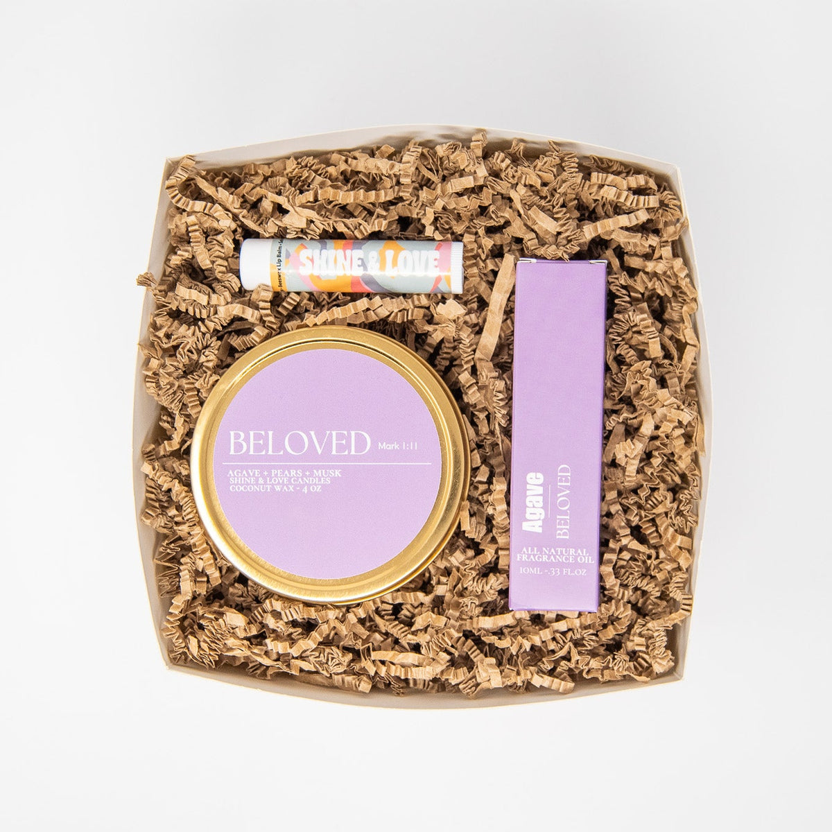 Cosmetic product with 'Beloved' branding perfume roll on, pears and cherry scented travel tin and chapstick