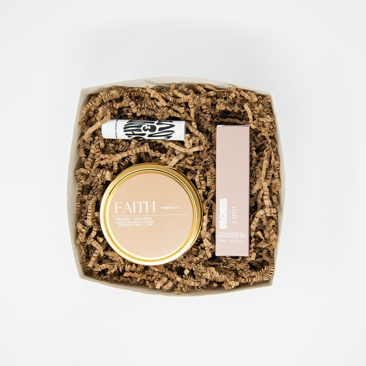 travel tin candle and roll on perfume oil and lip balm gift set