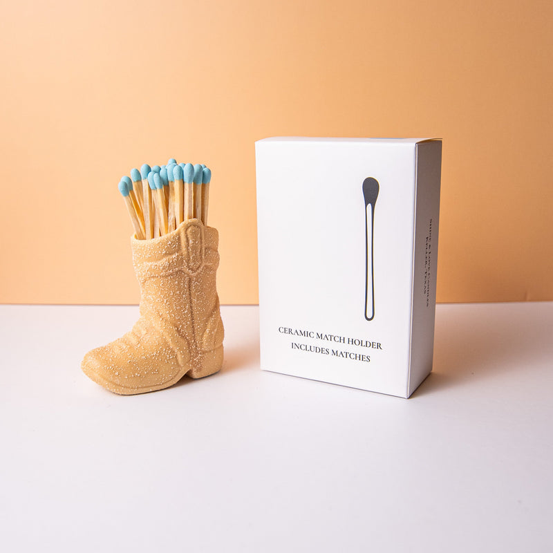 Ceramic match holder cowboy boot with color matches to pair with a candle